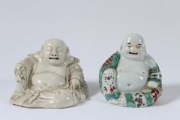 TWO CHINESE PORCELAIN LAUGHING BUDDHAS. 9cms high.