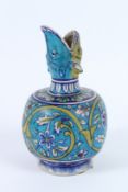 A CERAMIC BOTTLE VASE known as a SURAHI. Iznik pottery. 23cms high.