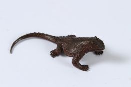 A JAPANESE BRONZE OKIMONO LIZARD. 10cms.