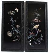 A PAIR OF CHINESE LACQUER PANELS with birds and flowers in mother-of -pearl. 62cms x 27cms.