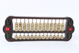 A CHINESE JADE ABACUS. 40cms long.