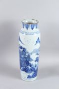 A GOOD 19TH CENTURY CHINESE BLUE AND WHITE VASE decorated with a mountain scene. 43cms high.