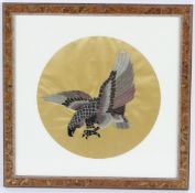 A CHINESE CIRCULAR SILKWORK PICTURE OF AN EAGLE. Framed and glazed. 20cms diameter.