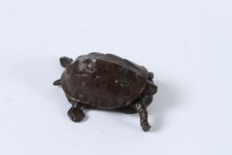 A JAPANESE BRONZE OKIMONO TURTLE with articulated head and tail. 5cms.