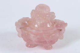 A CHINESE ROSE QUARTZ CIRCULAR KORO AND COVER with foo dog handles and three feet. 10cms high.