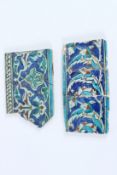 TWO 16TH - 17TH CENTURY OTTOMAN IZNIK GLAZED POTTERY BORDER TILES. 24cms x 13cms x 22cms x 1cm.
