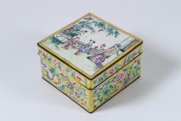 AN ANTIQUE CANTON ENAMEL TRINKET BOX, Mandarin design. 10cms square.
