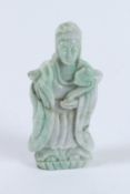 A SMALL CHINESE CARVED STONE GUANYIN. 11cms high.