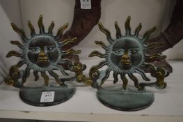 A pair of sunburst bronze bookends.