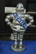 A metal model of the Michelin man.