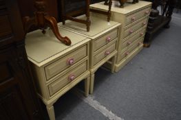A painted four drawer bedroom chest and pair of matching bedside chests.
