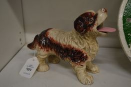 An amusing cast iron model of a dog.