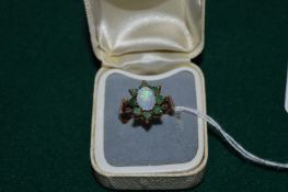 A 9ct gold opal and emerald ring.