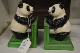 A pair of amusing cast iron panda bookends.