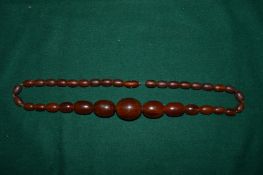 A chunky amber bead necklace.