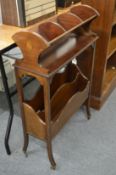 An Edwardian inlaid mahogany book trough/magazine rack.