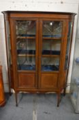An Edwardian inlaid mahogany two door display cabinet.