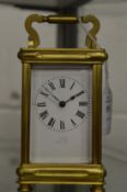 A brass carriage clock.