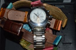 A wristwatch with various different straps.