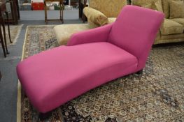 A modern purple upholstered chaise longue.