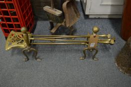 Brass firedogs and companion set.