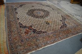 A good large Persian design carpet, beige ground with stylised decoration, 375cm x 304cm.