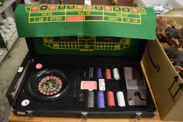 A cased roulette set.