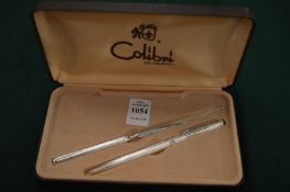 A Colibri cased gift set comprising pen and letter opener.