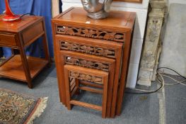 A nest of Chinese redwood tables.