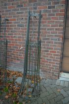 A pair of wrought iron tree guards.