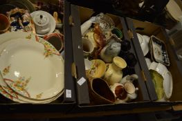 Three boxes of decorative china and glassware.