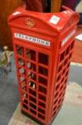 A novelty stick stand modelled as a telephone kiosk.