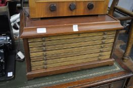 A mahogany table top coin collectors chest.