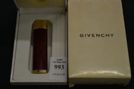 A Givenchy cigarette lighter, boxed.