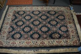 A Persian style carpet, green ground with stylised floral decoration, 185cm x 115cm.