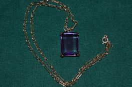 A 9ct gold and amethyst pendant and chain.