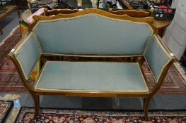 An Edwardian inlaid mahogany salon settee.
