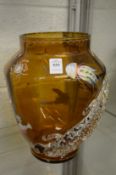 An unusual large amber tinted glass vase mounted with a clear glass lizard, the body painted with