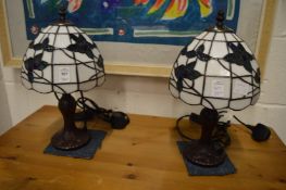 A pair of Tiffany style table lamps.