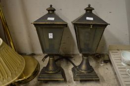 A pair of gate pier lamps.