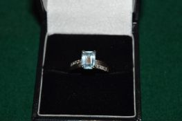 A 14ct white gold, diamond and aquamarine ring.