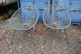 A pair of conical shaped garden chairs.