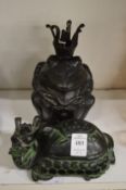 An Oriental carved dragon box and cover and a bronze model of a frog king.