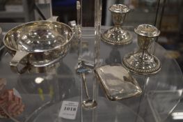 A group of small silverware.