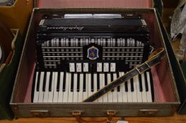 A Paolo Soprani accordion, cased.