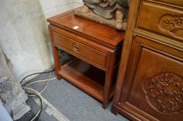 A pair of Chinese redwood two-tier single drawer lamp tables.
