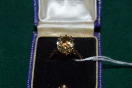A 9ct gold and gem set ring.