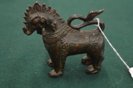 A small bronze model of a mythological beast.