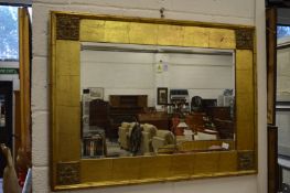 Decorative gilt framed rectangular wall mirror.