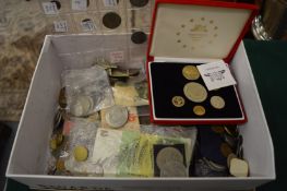 A large collection of various coins and bank notes.